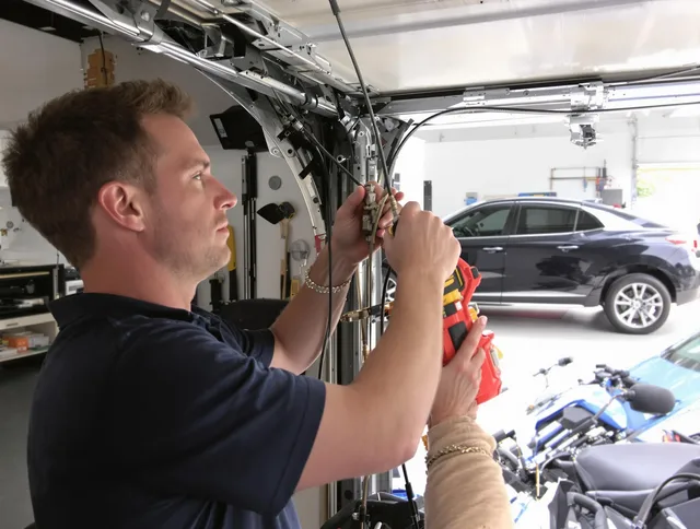 Westmont Garage Door Repair safety certified technician performing cable replacement in Westmont