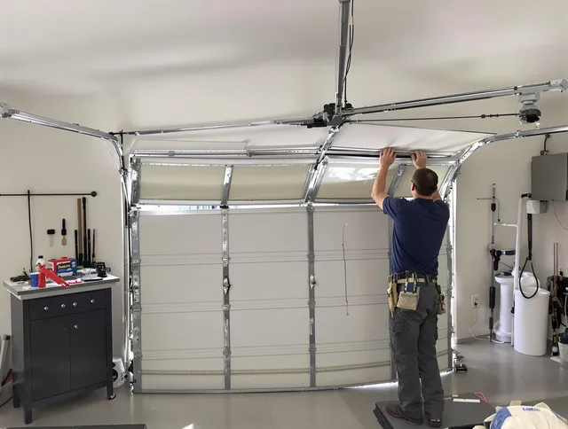 Westmont Garage Door Repair specialist performing precise section replacement on Westmont garage door